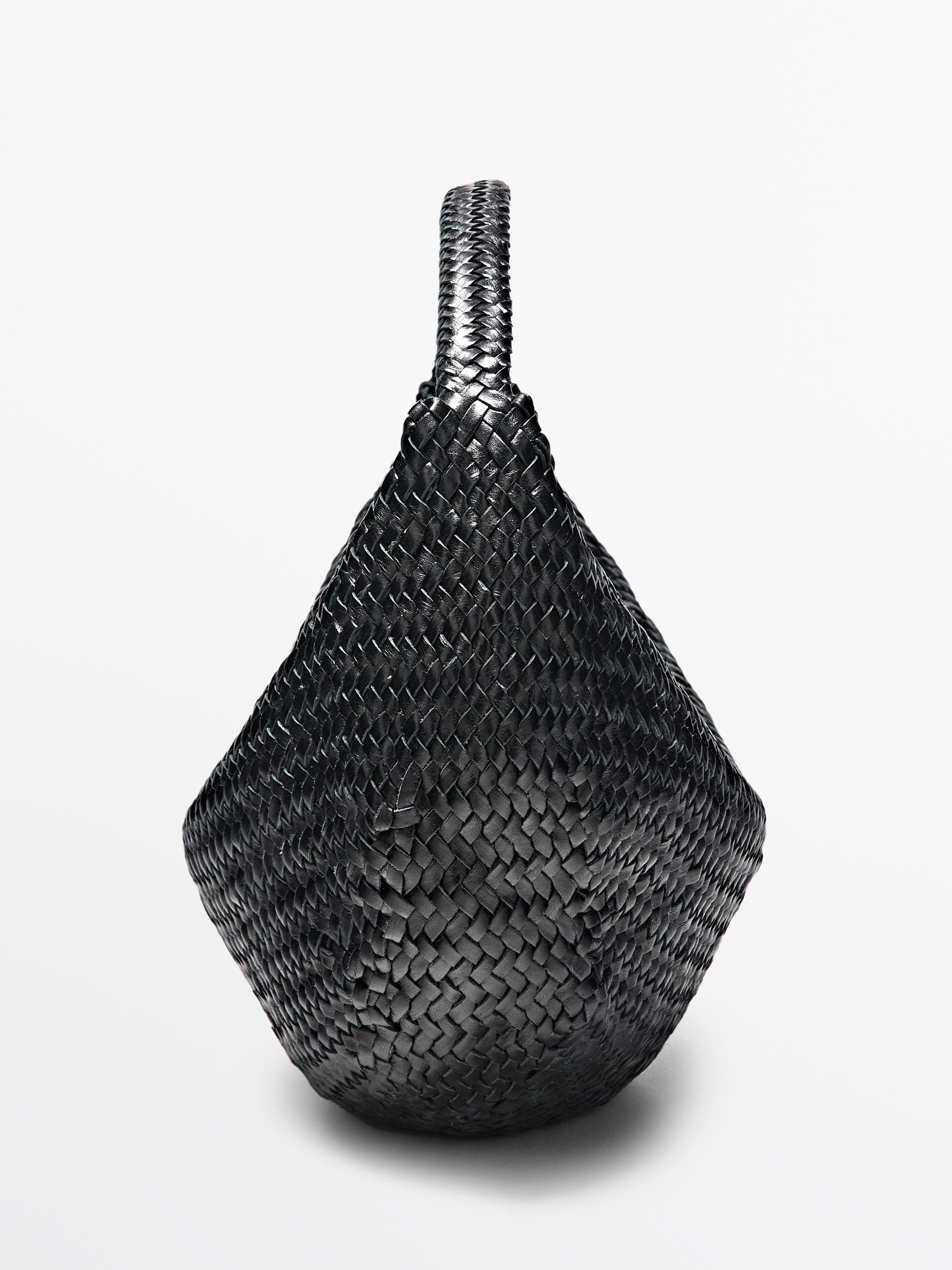 Braided leather half-moon bag
